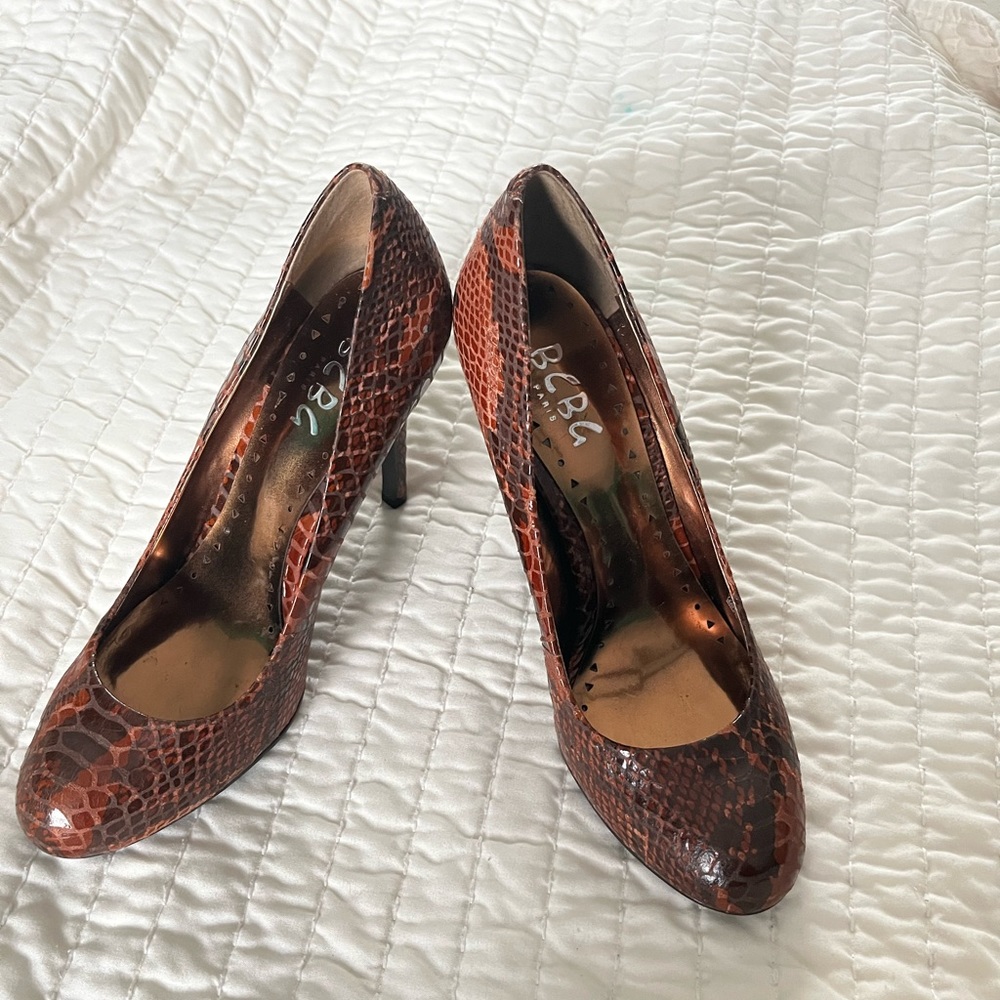 Brown snake print BCBG Paris pumps.